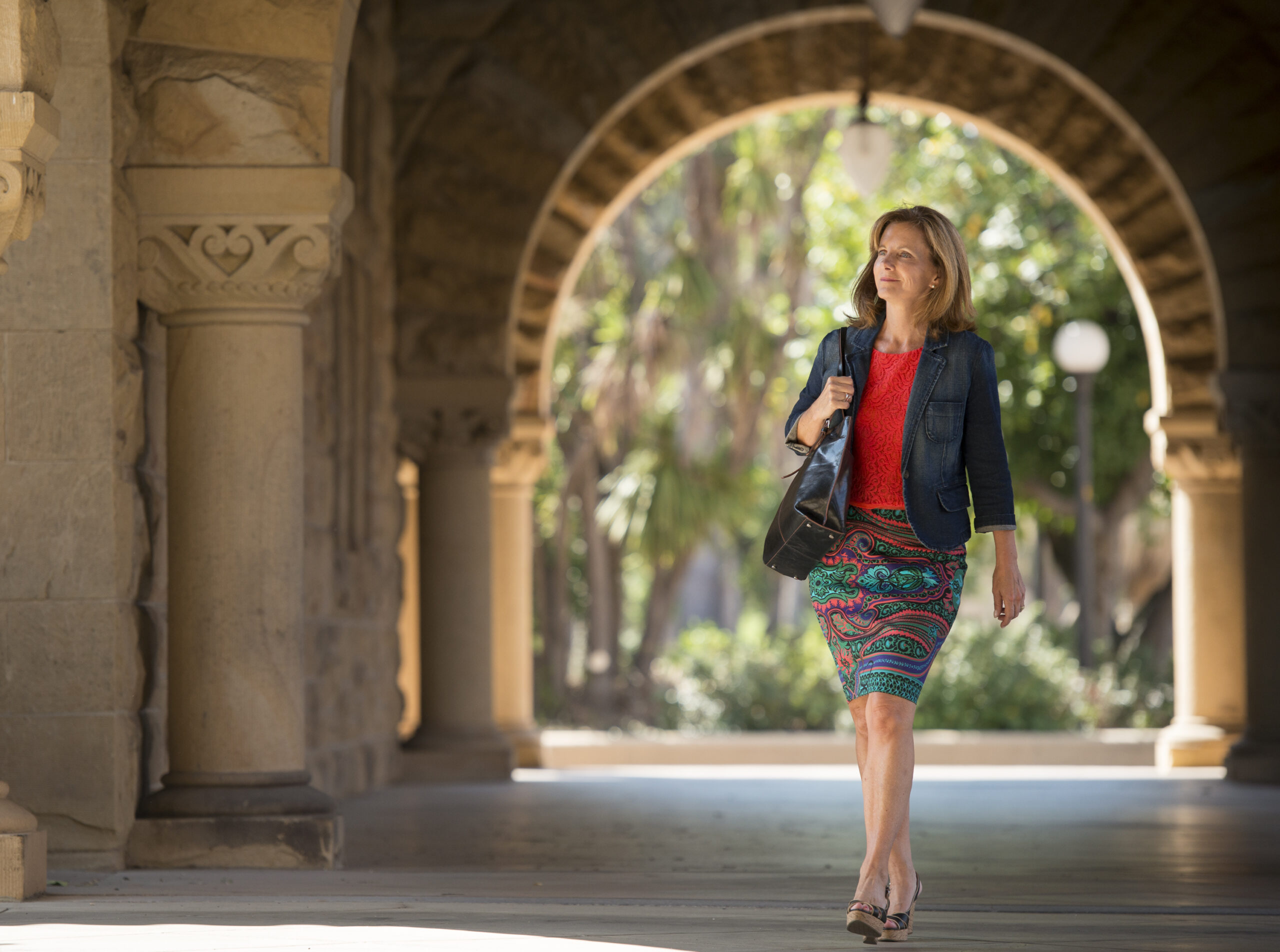 Kate Jerome walks under the iconic Stanford arches during her year as a DCI Fellow (2015)