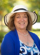 Small image_headshot of Bonnie Zavon wearing blue jacket and white hat.